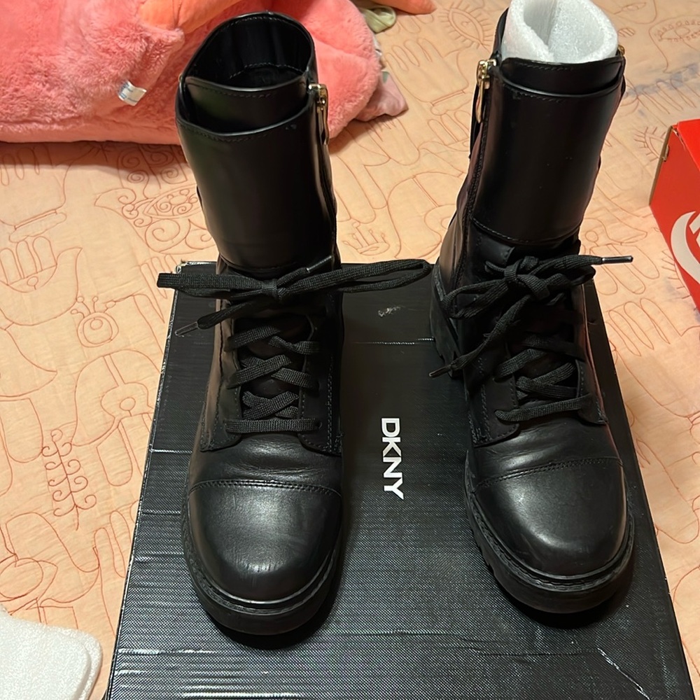 DKNY lace up with zipper on inside of boot. Great condition.